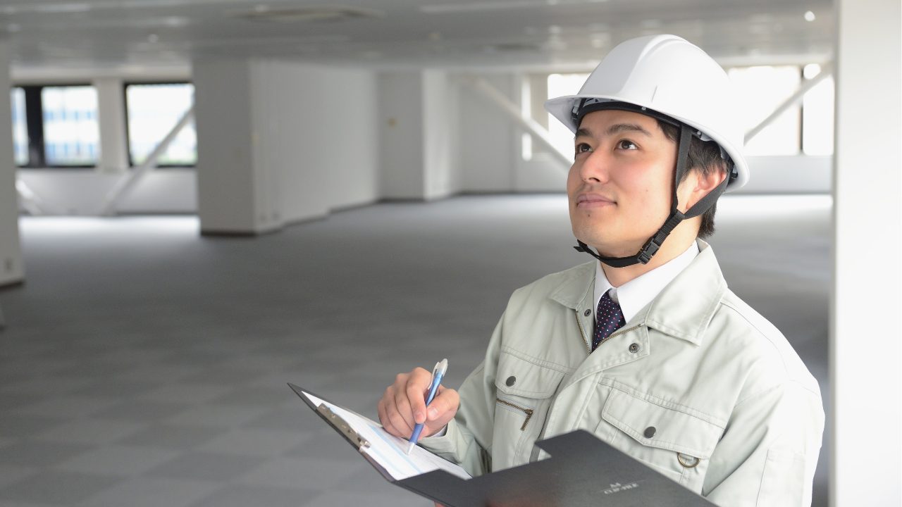 Man inspecting a building